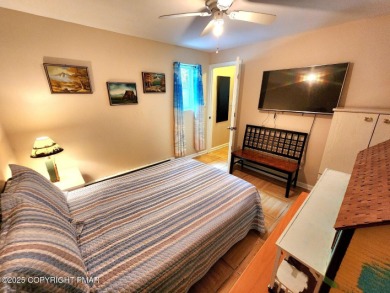 Experience the ultimate POCONO RETREAT!! This stunning raised on The Hideout Golf in Pennsylvania - for sale on GolfHomes.com, golf home, golf lot