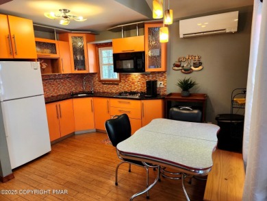 Experience the ultimate POCONO RETREAT!! This stunning raised on The Hideout Golf in Pennsylvania - for sale on GolfHomes.com, golf home, golf lot