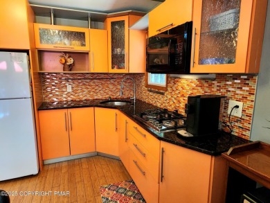 Experience the ultimate POCONO RETREAT!! This stunning raised on The Hideout Golf in Pennsylvania - for sale on GolfHomes.com, golf home, golf lot