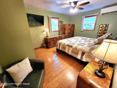 Experience the ultimate POCONO RETREAT!! This stunning raised on The Hideout Golf in Pennsylvania - for sale on GolfHomes.com, golf home, golf lot