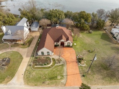 This stunning home is inside a secured gated community that is on White Bluff Resort - Old Course in Texas - for sale on GolfHomes.com, golf home, golf lot