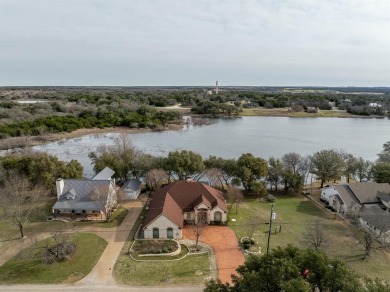 This stunning home is inside a secured gated community that is on White Bluff Resort - Old Course in Texas - for sale on GolfHomes.com, golf home, golf lot