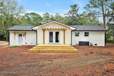 This beautifully renovated single-story home offers a modern on The Lakes Country Club in North Carolina - for sale on GolfHomes.com, golf home, golf lot