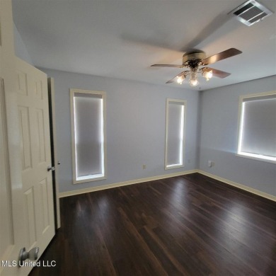 Modern single-family home for sale in Diamondhead, MS!-Luxury on Diamondhead Country Club in Mississippi - for sale on GolfHomes.com, golf home, golf lot