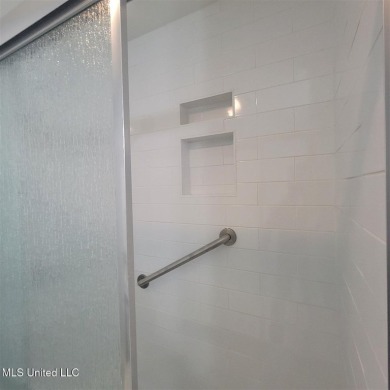 Modern single-family home for sale in Diamondhead, MS!-Luxury on Diamondhead Country Club in Mississippi - for sale on GolfHomes.com, golf home, golf lot