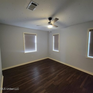 Modern single-family home for sale in Diamondhead, MS!-Luxury on Diamondhead Country Club in Mississippi - for sale on GolfHomes.com, golf home, golf lot