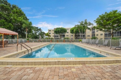 PENTHOUSE VIEWS WELCOME YOU TO  GOLF,POOL & GARDEN VIEWS FROM A on Poinciana Golf Club in Florida - for sale on GolfHomes.com, golf home, golf lot