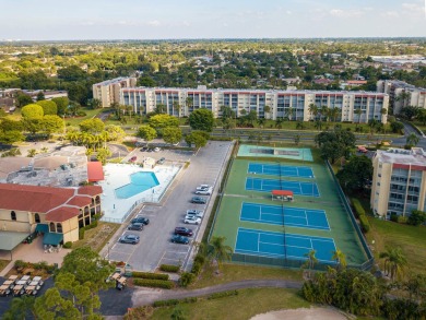 PENTHOUSE VIEWS WELCOME YOU TO  GOLF,POOL & GARDEN VIEWS FROM A on Poinciana Golf Club in Florida - for sale on GolfHomes.com, golf home, golf lot