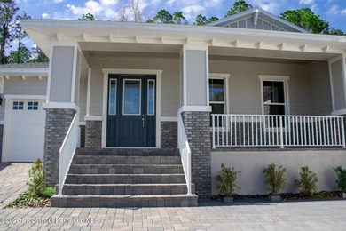 This beautiful semi-custom home by Spire Homes is set on a on Southern Hills Plantation Club in Florida - for sale on GolfHomes.com, golf home, golf lot