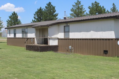 Nestled across the street from the golf course and just a minute on Clayton Golf Club in New Mexico - for sale on GolfHomes.com, golf home, golf lot