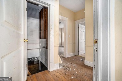 Sold as-is, this investor-friendly ranch home presents a rare on John A. White Golf Course in Georgia - for sale on GolfHomes.com, golf home, golf lot