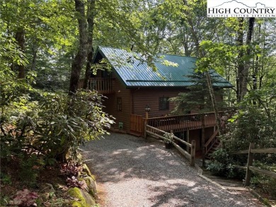 Well-loved mountain home tucked in the woods along the golf on Land Harbor Golf Course in North Carolina - for sale on GolfHomes.com, golf home, golf lot