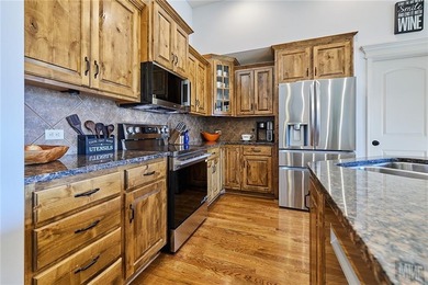 Welcome home to 707 Tomahawk Court! This immaculate, elevated on Paradise Pointe Golf Complex in Missouri - for sale on GolfHomes.com, golf home, golf lot