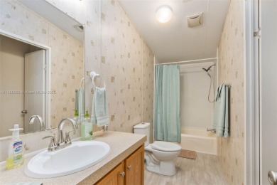 Welcome to this BEAUTIFUL, meticulously maintained manufactured on Davie Golf Club in Florida - for sale on GolfHomes.com, golf home, golf lot