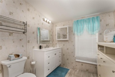 Welcome to this BEAUTIFUL, meticulously maintained manufactured on Davie Golf Club in Florida - for sale on GolfHomes.com, golf home, golf lot