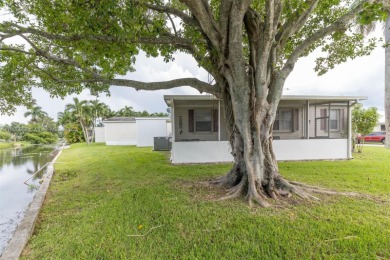 Welcome to this BEAUTIFUL, meticulously maintained manufactured on Davie Golf Club in Florida - for sale on GolfHomes.com, golf home, golf lot