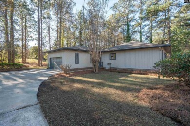 Welcome to 404 Wotan Rd, a fully remodeled 4-bedroom, 2.5-bath on The Woodlands Country Club in South Carolina - for sale on GolfHomes.com, golf home, golf lot