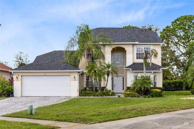 This elegant single-family home in the gated Sandhill Trace on Hunters Creek Golf Course in Florida - for sale on GolfHomes.com, golf home, golf lot