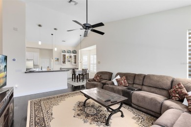 This elegant single-family home in the gated Sandhill Trace on Hunters Creek Golf Course in Florida - for sale on GolfHomes.com, golf home, golf lot