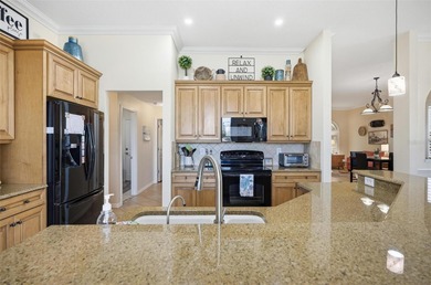 Stunning lake and golf course views from this beautifully on Grand Haven Golf Club in Florida - for sale on GolfHomes.com, golf home, golf lot