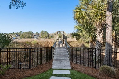 Completed in 2022, this custom creek and marsh front residence on Charleston National Golf Club in South Carolina - for sale on GolfHomes.com, golf home, golf lot