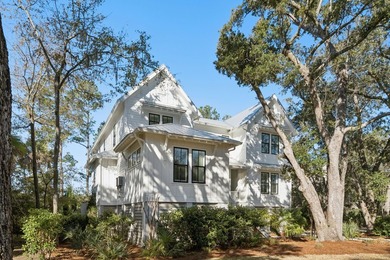 Completed in 2022, this custom creek and marsh front residence on Charleston National Golf Club in South Carolina - for sale on GolfHomes.com, golf home, golf lot