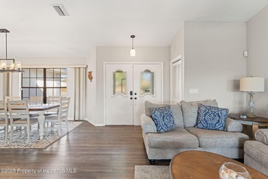 Welcome to this beautifully updated 3-bedroom, 2-bath, 3-car on Oak Hills Country Club in Florida - for sale on GolfHomes.com, golf home, golf lot