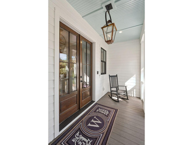 Completed in 2022, this custom creek and marsh front residence on Charleston National Golf Club in South Carolina - for sale on GolfHomes.com, golf home, golf lot