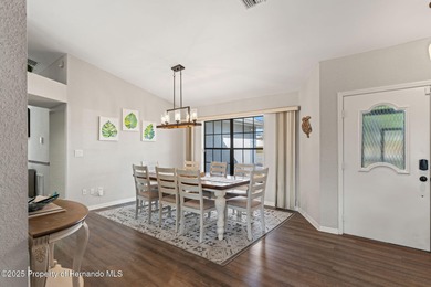 Welcome to this beautifully updated 3-bedroom, 2-bath, 3-car on Oak Hills Country Club in Florida - for sale on GolfHomes.com, golf home, golf lot