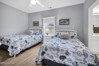 Experience the pinnacle of coastal living in this elegant on Sea Trail Golf Resort in North Carolina - for sale on GolfHomes.com, golf home, golf lot