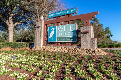 Nestled within the secure, gated community of Wild Heron, you'll on Sharks Tooth Golf Club in Florida - for sale on GolfHomes.com, golf home, golf lot