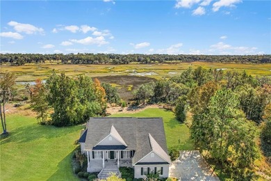 This three bedroom, two and one-half bath home with a marshview on Sapelo Hammock Golf Club in Georgia - for sale on GolfHomes.com, golf home, golf lot