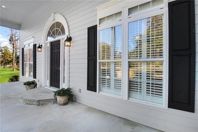 This three bedroom, two and one-half bath home with a marshview on Sapelo Hammock Golf Club in Georgia - for sale on GolfHomes.com, golf home, golf lot