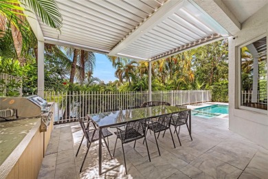 Located in an exclusive gated community, this stunning 5-bedroom on Turnberry Isle Resort and Club in Florida - for sale on GolfHomes.com, golf home, golf lot