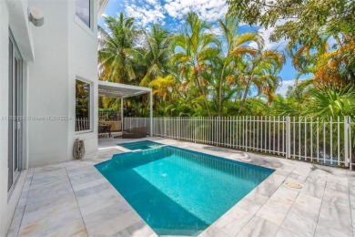 Located in an exclusive gated community, this stunning 5-bedroom on Turnberry Isle Resort and Club in Florida - for sale on GolfHomes.com, golf home, golf lot