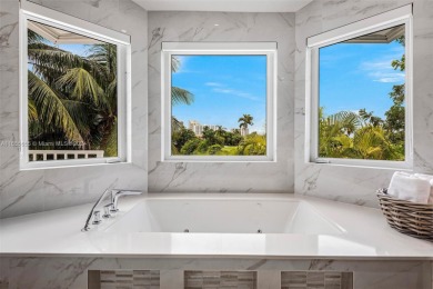 Located in an exclusive gated community, this stunning 5-bedroom on Turnberry Isle Resort and Club in Florida - for sale on GolfHomes.com, golf home, golf lot