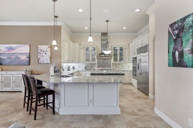Welcome to your dream home--an elegant three-bedroom on Lakewood Ranch Golf and Country Club in Florida - for sale on GolfHomes.com, golf home, golf lot