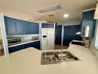 This home just listed and has 2 sheds! One has a separate on Water Oak Country Club Estates in Florida - for sale on GolfHomes.com, golf home, golf lot