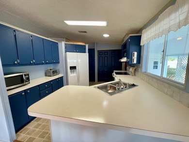 This home just listed and has 2 sheds! One has a separate on Water Oak Country Club Estates in Florida - for sale on GolfHomes.com, golf home, golf lot