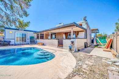 Picture warm summer nights lounging by your pool and a golf on Villa De Paz Golf Course in Arizona - for sale on GolfHomes.com, golf home, golf lot