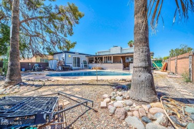 Picture warm summer nights lounging by your pool and a golf on Villa De Paz Golf Course in Arizona - for sale on GolfHomes.com, golf home, golf lot