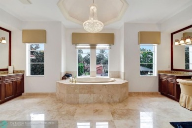 Located In The Heart Of Boca Raton, This Three-story Estate In on Polo Club of Boca Raton in Florida - for sale on GolfHomes.com, golf home, golf lot