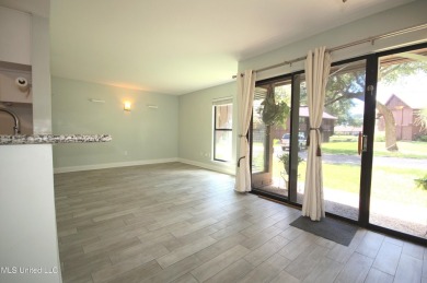 Welcome to your dream villa nestled in the vibrant heart of on Diamondhead Country Club in Mississippi - for sale on GolfHomes.com, golf home, golf lot