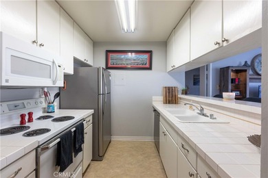 This charming one-bedroom corner unit in the gated Bixby Village on Bixby Village Golf Course in California - for sale on GolfHomes.com, golf home, golf lot