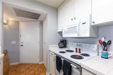 This charming one-bedroom corner unit in the gated Bixby Village on Bixby Village Golf Course in California - for sale on GolfHomes.com, golf home, golf lot