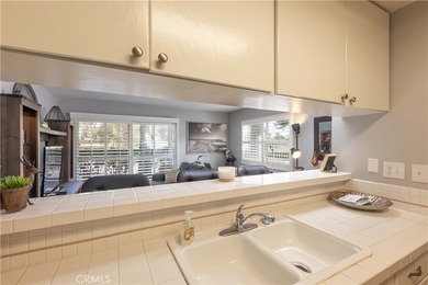 This charming one-bedroom corner unit in the gated Bixby Village on Bixby Village Golf Course in California - for sale on GolfHomes.com, golf home, golf lot