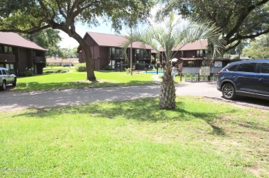Welcome to your dream villa nestled in the vibrant heart of on Diamondhead Country Club in Mississippi - for sale on GolfHomes.com, golf home, golf lot