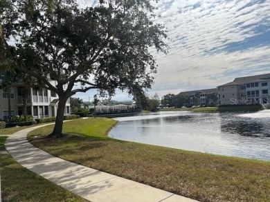 This ideal second floor condo has a sweeping view of the lake on Manatee County Golf Course in Florida - for sale on GolfHomes.com, golf home, golf lot