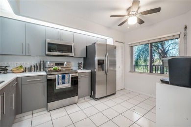 BEAUTIFUL 2 BEDROOMS 2 BATHROOMS LARGE UNIT OVERLOOKING A on Flamingo Lakes Country Club in Florida - for sale on GolfHomes.com, golf home, golf lot