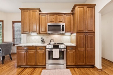 This beautifully updated Reflection Ridge ranch offers an ideal on Reflection Ridge Golf Club in Kansas - for sale on GolfHomes.com, golf home, golf lot